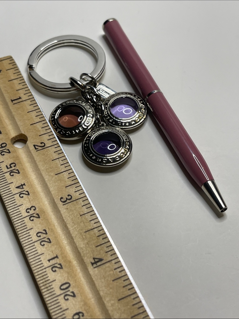 Coach Silver Circle Charm Keychain with Purple and Pink Accents and a Coach Pen - Picture 3 of 5